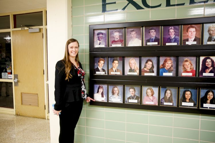 Dr. Fitzpatrick finds her photo on the EAHS Wall of Excellence