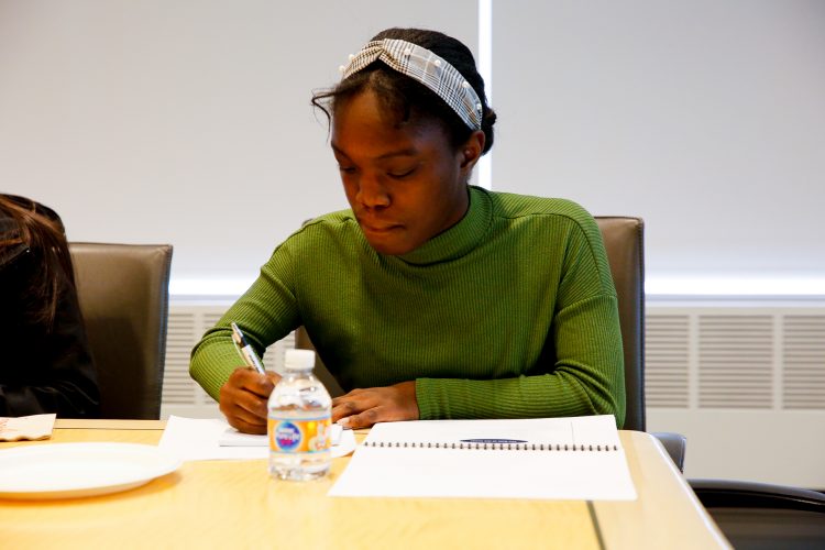 Tomcat senior Jenessa Davis takes notes during "Bonds 101" presentation