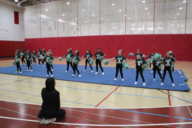 Cheerleaders practice their routine before the tournament.