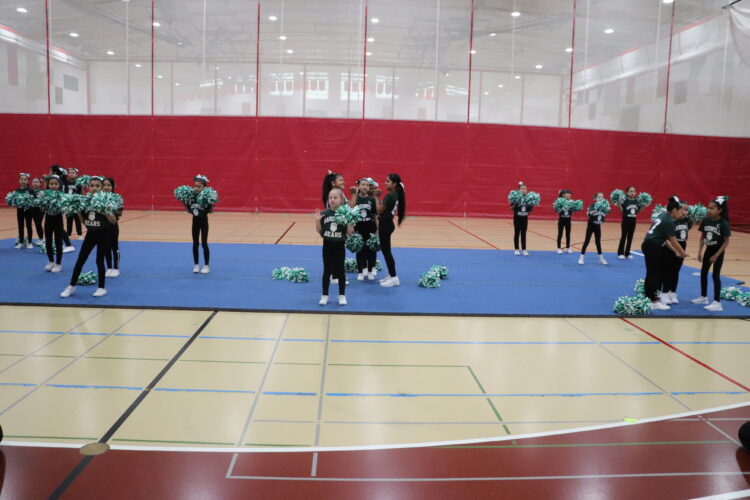 Cheerleaders practice their routine before the tournament.