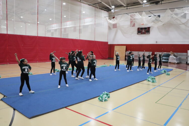 Cheerleaders practice their routine before the tournament.