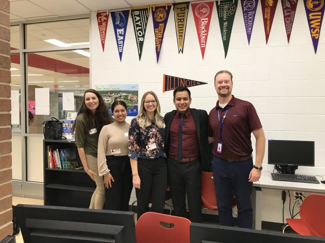 College and Career Counselor Andrew Rathje with Aurora University Director of Admissions Joel Ortega and his admissions counselors.