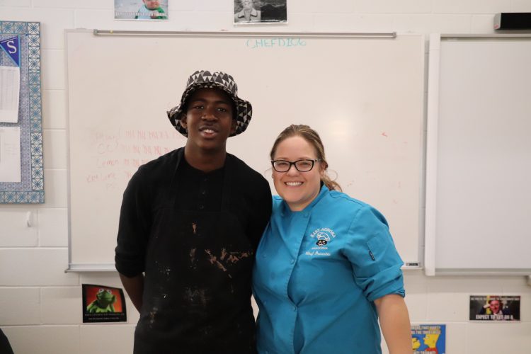Chef Doucette with a Tomcat chef-in-training.