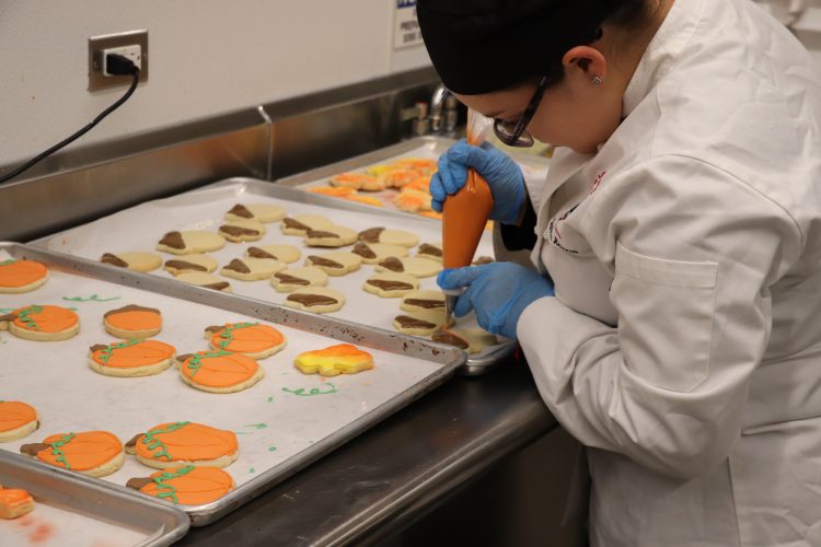 Adding the finishing touches to dessert.